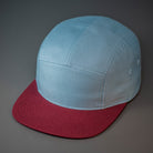A Smoke Blue & Maroon, Cotton Twill, Blank 5 Panel Camp Hat With a Flat Bill, & Woven Nylon Strapback.  Designed by Blvnk Headwear.
