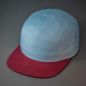 A Smoke Blue & Maroon, Cotton Twill, Blank 5 Panel Camp Hat With a Flat Bill, & Woven Nylon Strapback.  Designed by Blvnk Headwear.