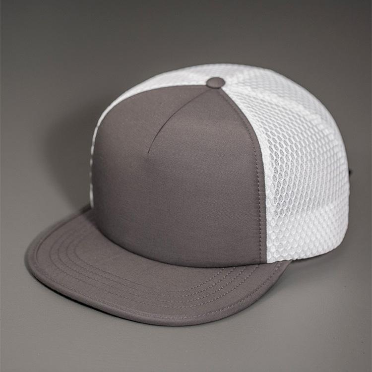 A Water Resistant Nylon, Blank Trucker Hat with a Packable Flotation Bill with a Hydro Mesh back & Woven Nylon Strapback.  |  Grey & White Colorway by BLVNK Headwear.