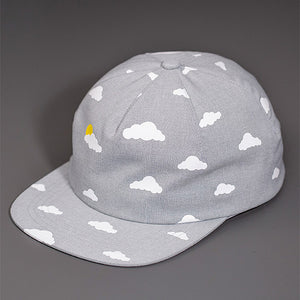 A 2 Color, Cloud Pattern, Screen Printed on grey Chambray, Blank 1 Panel Hat, W/ a Flat Bill & Matching Chambray Strapback.  |  Designed by Blvnk Headwear