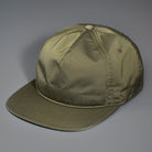 An Olive, Unstructured Satin Nylon, Blank Hat W/ a Pinch Front Crown, Flat Bill & a Classic Snapback.  |  Designed by Blvnk Headwear