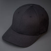 A Black, 6 Panel, Blank, Flex Back Twill Crown Hat W/ a Pre Curved Bill.  Designed by Blvnk Headwear.