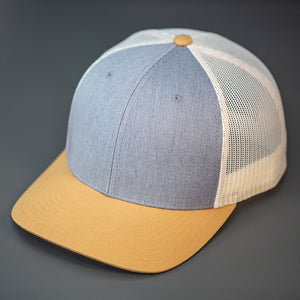 A Heather Grey, Birch & Biscuit, Cotton Twill, Mesh Backed, Blank Trucker Hat with a Pre Curved Bill, & Classic Snapback.  |  Designed by Blvnk Headwear