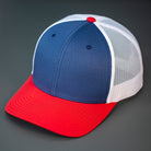 A Light Navy, White & Red, Cotton Twill, Mesh Backed, Blank Trucker Hat with a Pre Curved Bill, & Classic Snapback.  |  Designed by Blvnk Headwear