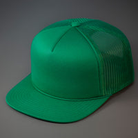 A Green, Foam Front, Mesh Backed Blank Trucker Hat with a Flat Bill, & Classic Snapback.  Designed by Blvnk Headwear.