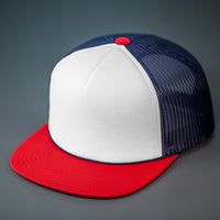 A White, Navy & Red, Foam Front, Mesh Backed Blank Trucker Hat with a Flat Bill, & Classic Snapback.  Designed by Blvnk Headwear.