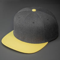 A Heather Charcoal & Banana Yellow, Wool, 6 Panel, Flat Bill, Blank Snapback.  Designed by Blvnk Headwear.