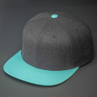 A Heather Charcoal & Blue Tint, Wool, 6 Panel, Flat Bill, Blank Snapback.  Designed by Blvnk Headwear.