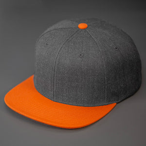 A Heather Charcoal & Orange, Wool, 6 Panel, Flat Bill, Blank Snapback.  Designed by Blvnk Headwear.