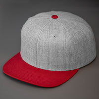 A Heather Grey & Tibet Red, Wool, 6 Panel, Flat Bill, Blank Snapback.  Designed by Blvnk Headwear.