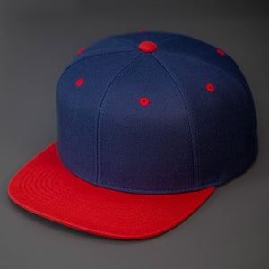 A Navy & Red, Wool, 6 Panel, Flat Bill, Blank Snapback.  Designed by Blvnk Headwear.