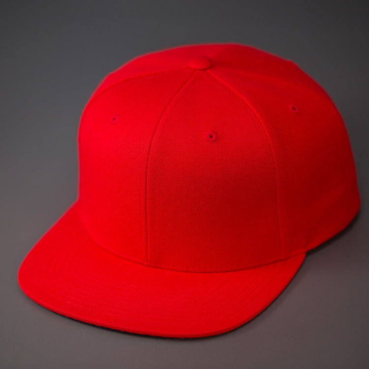 A Red, Wool, 6 Panel, Flat Bill, Blank Snapback.  Designed by Blvnk Headwear.