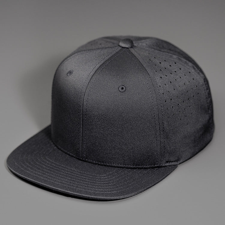 A Black Performance Stretch Crown, Blank 6 Panel Hat, Featuring Custom Perforated Back Panels, Flat Bill & Classic Snapback.  Designed by Blvnk Headwear.