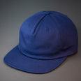 A Navy Blue, Unstructured, Premium Cotton, Blank Pinch Front Hat With a Vegan Leather Back Strap & Brass Clasp.  Designed By Blvnk Headwear.