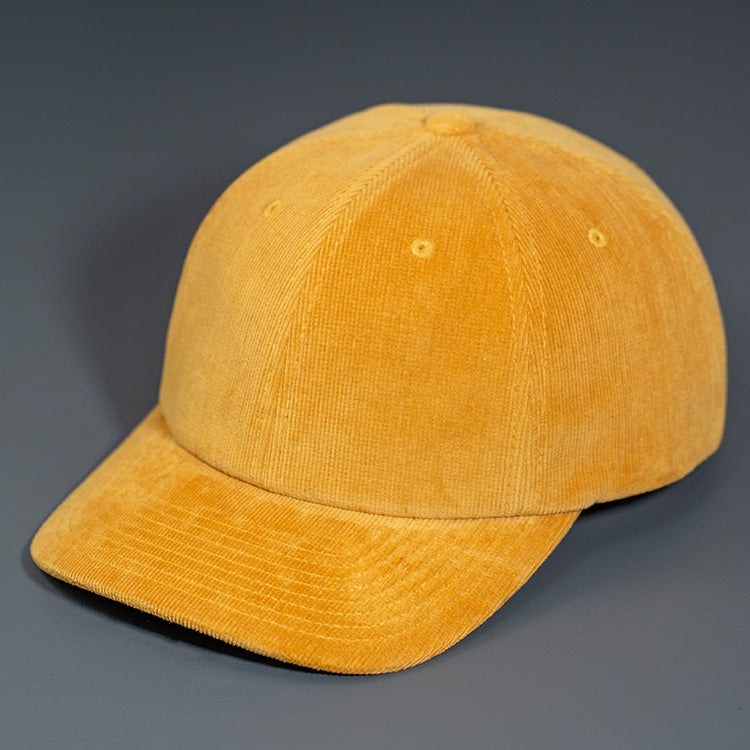 A Butterscotch Corduroy, 6 Panel Crown, Blank Dad Hat with a matching fabric Back Strap & Brass Clasp.  Designed by Blvnk Headwear.