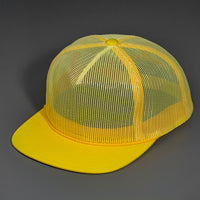 A Yellow, Full Mesh, Flat Bill Blank Trucker Hat W/ Classic Snapback