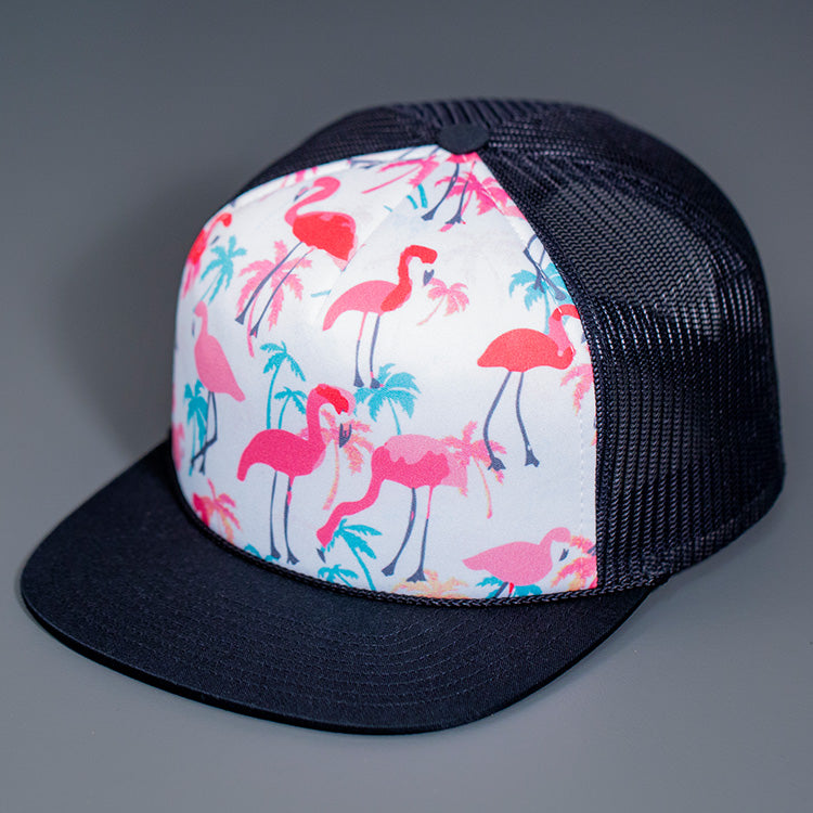 The Mild Style Flamingo Printed Foam Front, Black Mesh Backed, Blank Trucker Hat with a Black Flat Bill, & Classic Snapback.  Designed By Blvnk Headwear.