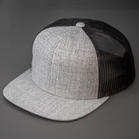 A Heather Grey Wool Crown, Blank Trucker Hat, With Black Mesh Back Panels, Flat Bill & Classic Snapback.  Designed by Blvnk Headwear.