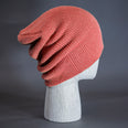 A Coral Pink colored, super slouch knit blank beanie. Designed by Blvnk Headwear.