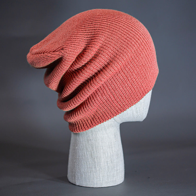 A Coral Pink colored, super slouch knit blank beanie. Designed by Blvnk Headwear.