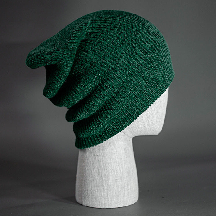 A Forest colored, super slouch knit blank beanie. Designed by Blvnk Headwear.