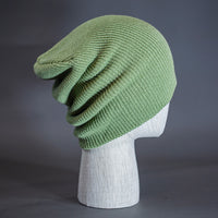 A Sage colored, super slouch knit blank beanie. Designed by Blvnk Headwear.