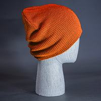 The Burnside Beanie, a blaze orange colored, soft slouch knit, blank beanie. Designed by Blvnk Headwear.