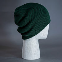 The Burnside Beanie, a forest colored, soft slouch knit, blank beanie. Designed by Blvnk Headwear.