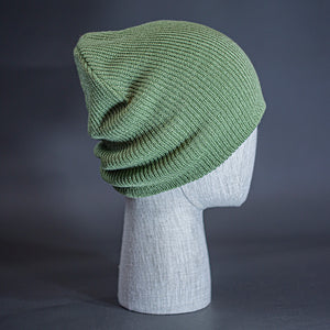 The Burnside Beanie, a sage colored, soft slouch knit, blank beanie. Designed by Blvnk Headwear.