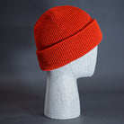 The Waffle Beanie, a blaze orange colored, waffle knit blank beanie. Designed by Blvnk Headwear.