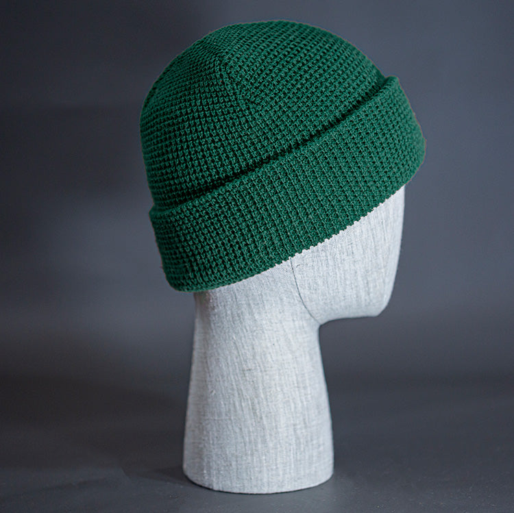 The Waffle Beanie, a forest colored, waffle knit blank beanie. Designed by Blvnk Headwear.