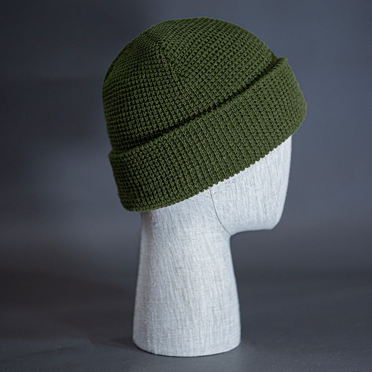 The Waffle Beanie, a military olive colored, waffle knit blank beanie. Designed by Blvnk Headwear.