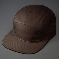 A Slate, Herringbone, Blank 5 Panel Camp Hat With a Flat Bill.  Designed by Blvnk Headwear.