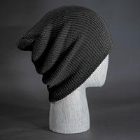 A black colored, super slouch knit blank beanie.  Designed by Blvnk Headwear.