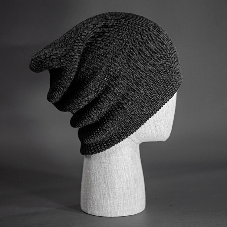 A heather charcoal colored, super slouch knit blank beanie.  Designed by Blvnk Headwear.