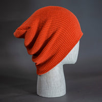A rust colored, super slouch knit blank beanie.  Designed by Blvnk Headwear.