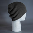 The Burnside Beanie, a heather charcoal colored, soft slouch knit, blank beanie. Designed by Blvnk Headwear.