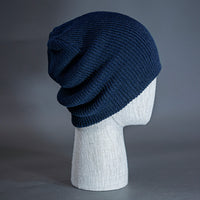 The Burnside Beanie, a navy colored, soft slouch knit, blank beanie. Designed by Blvnk Headwear.