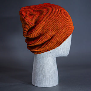 The Burnside Beanie, a rust colored, soft slouch knit, blank beanie. Designed by Blvnk Headwear.