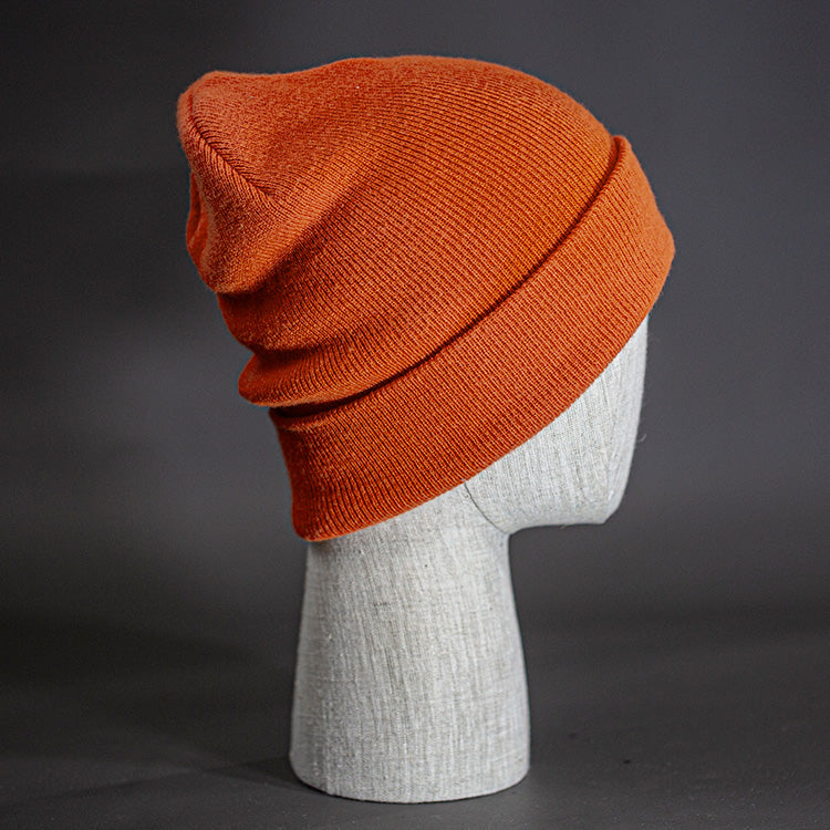 The Hood Beanie, a burnt orange colored, tight knit, mid length blank beanie. Designed by Blvnk Headwear.