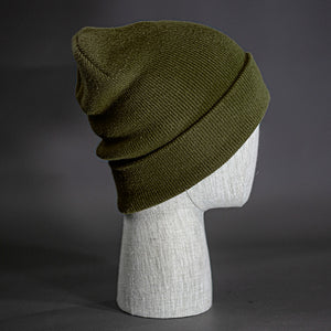 The Hood Beanie, a loden colored, tight knit, mid length blank beanie. Designed by Blvnk Headwear.