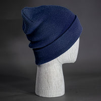 The Hood Beanie, a navy colored, tight knit, mid length blank beanie. Designed by Blvnk Headwear.