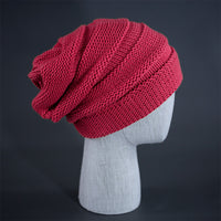 A coral pink colored, alternating rib knit blank beanie with a pre scrunched back.  Designed by Blvnk Headwear.