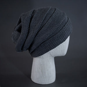 A heather grey colored, alternating rib knit blank beanie with a pre scrunched back.  Designed by Blvnk Headwear.