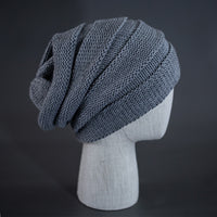 A heather grey colored, alternating rib knit blank beanie with a pre scrunched back.  Designed by Blvnk Headwear.