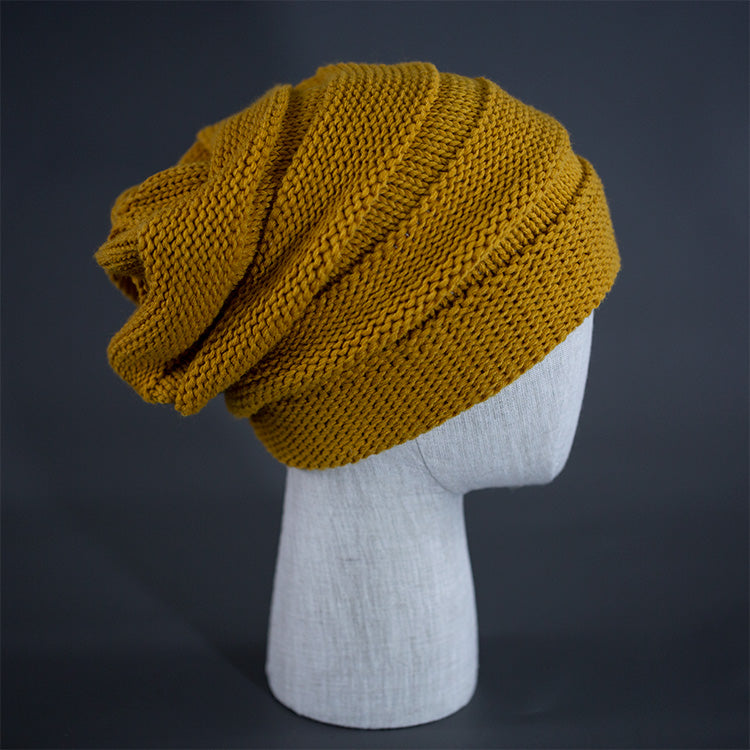 A wheat colored, alternating rib knit blank beanie with a pre scrunched back.  Designed by Blvnk Headwear.