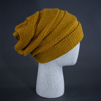 A wheat colored, alternating rib knit blank beanie with a pre scrunched back.  Designed by Blvnk Headwear.