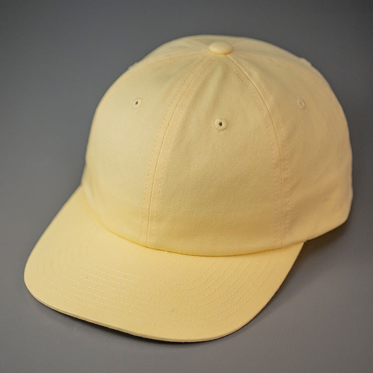 A Banana Yellow, Premium Cotton, 6 Panel Crown, Blank Dad Hat.  Designed by Blvnk Headwear.
