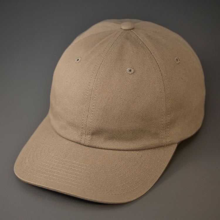 A Driftwood Colored, Premium Cotton, 6 Panel Crown, Blank Dad Hat.  Designed by Blvnk Headwear.