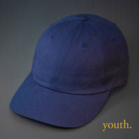A Youth Sized, Navy, Premium Cotton, 6 Panel Crown, Blank Dad Hat.  Designed by Blvnk Headwear.